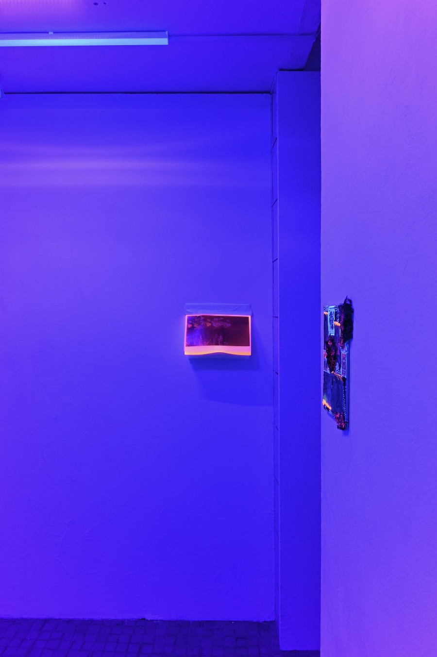 "Shi Deh Deh," 2024/2026, photo print on pergament paper, print on neon orange paper, tape, 26 x 29,7 x 10,6 cm. "Shi Deh Deh" by Jasmine Tutum at Kaiserwache, Freiburg im Breisgau, 2026. Photo by Stefan Lux.