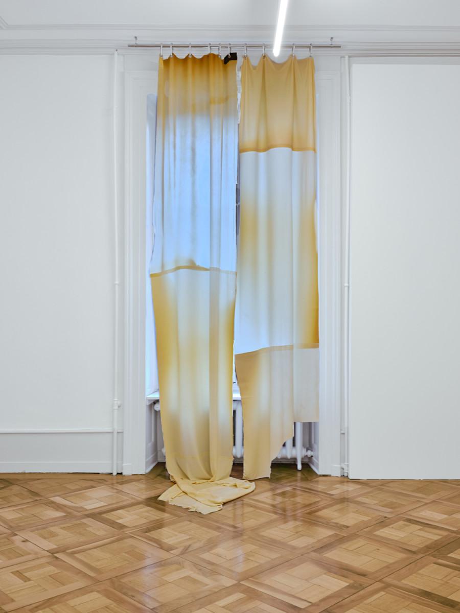 Exhibition View, ‘Stitches: A Haunted House and Other Ghost Stories’ at the Villa Bernasconi, 2026 / Photo by Nicolas Delaroche Studio. Li Tavor, Bright Curtains I, II, III, 2025, pigmented latex curtains, aluminum, carabiners