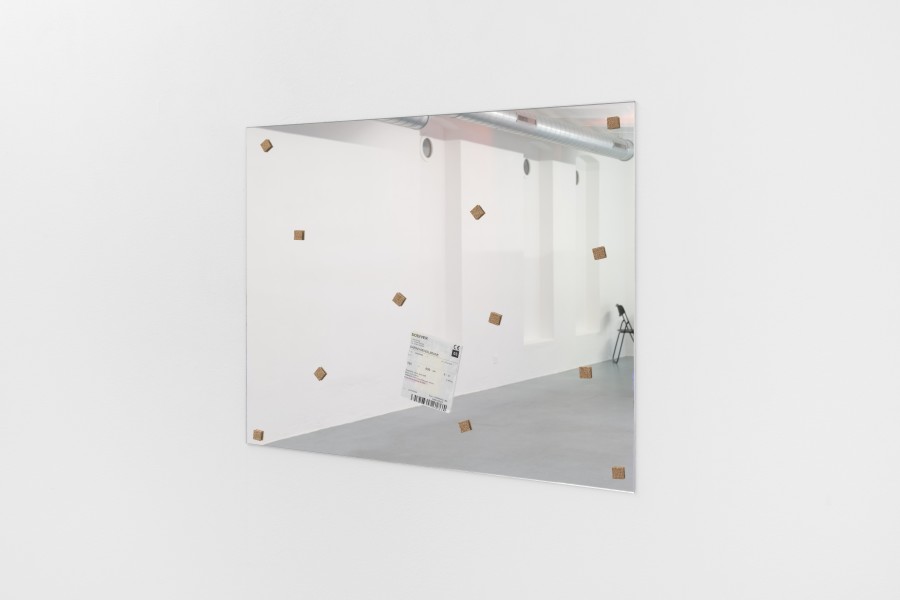 Sarah Benslimane, Untitled, 2025, Mirror, transport etiquette, cork, 60 × 76 × 1 cm. Photo credits: marytwo