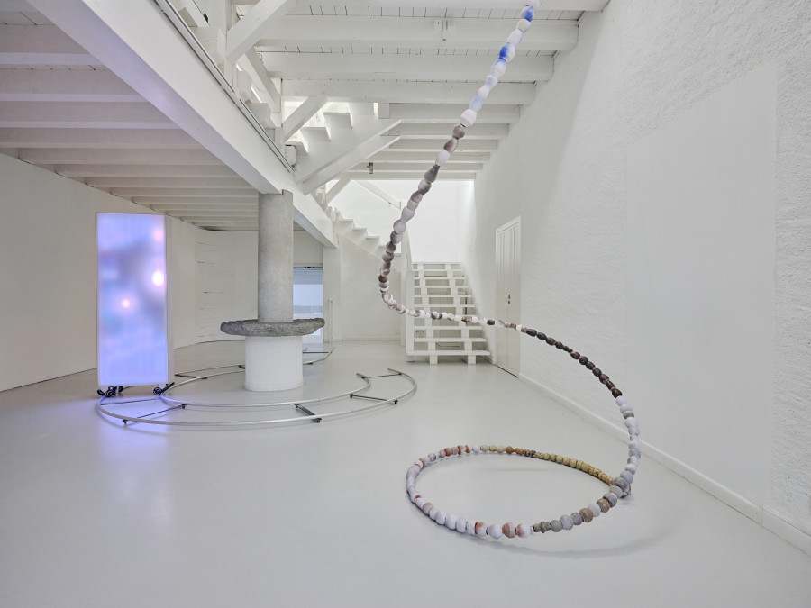 Camille Dumond, Everything but sliced, Ferme de la Chapelle, Geneva, Sept-Oct 2025. Left: Camille Dumond, Power of the spin, Installation and wall elements, aluminum, steel, wood, LED, 5.30 × 3.30 m, 2025. Right: Camille Dumond, Bullet time, Suspension, steel, earthenware, stoneware, 4.5 m, 2025. Photo credit: ©Nicolas Delaroche Studio