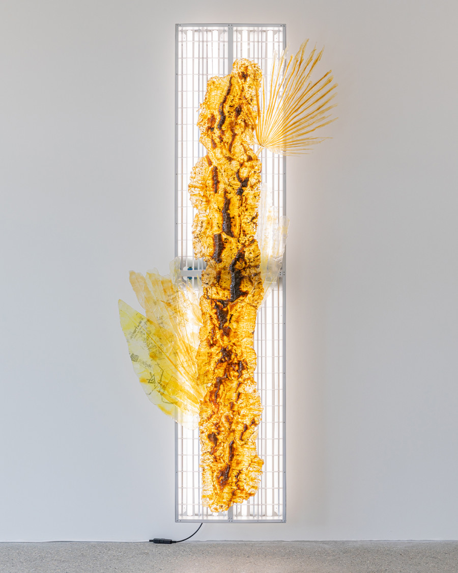 Exhibition view ‘This is the time of sweet sweet change for us all’; Chloé Delarue, TAFAA - UNNECESSARY DOUBT (SNITCH II), 2024, latex, resin, transfer print, aluminium, fluorescent tubes, 240 x 90 x 20cm, CALM - Centre d'Art La Meute, Lausanne, Switzerland, 2024 / Photo: Théo Dufloo / Courtesy of the artist, galerie frank elbaz and CALM - Centre d'Art La Meute.