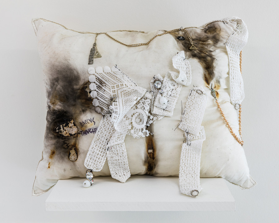 Exhibition view ‘This is the time of sweet sweet change for us all’; Élie Autin, Pillow, 2023, hand-sewn cushion with sewn additions, 60 x 50cm, CALM - Centre d'Art La Meute, Lausanne, Switzerland, 2024 / Photo: Théo Dufloo / Courtesy of the artist and CALM - Centre d'Art La Meute.