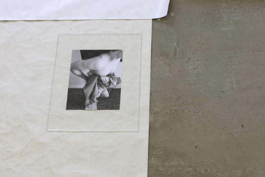 Exhibition view, Sven Gex, celebratory, Halmet, Zürich, 2025. Sven Gex, celebratory, 2025, gift wrapping paper, nails, glass, printed images from the ‚character fitting‘ series 2021-ongoing