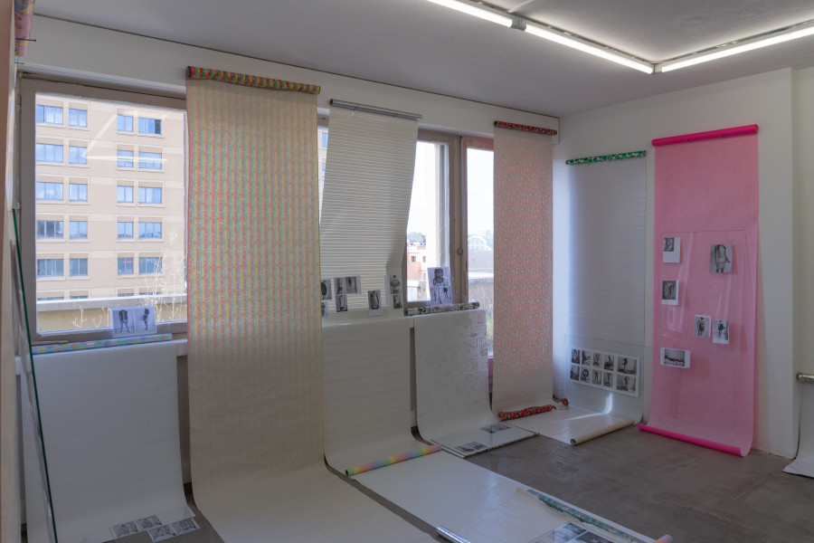 Exhibition view, Sven Gex, celebratory, Halmet, Zürich, 2025. Sven Gex, celebratory, 2025, gift wrapping paper, nails, glass, printed images from the ‚character fitting‘ series 2021-ongoing