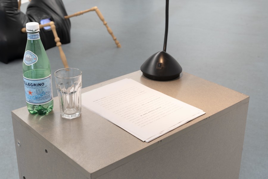 Joana-Maria Peralta-Ferrer, Lecture on Raphael Alcampo by Sylvia P. Greenwood (detail), 2025, Performance, slideshow, chairs, plynth, 20:00’, dimensions variable. Photo credits: marytwo