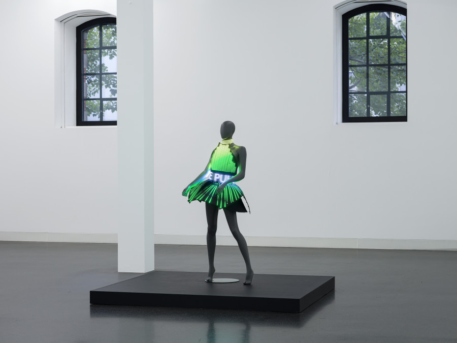 Puppies Puppies (Jade Guanaro Kuriki-Olivo), Electric Dress (Atsuko Tanaka), 2023, LED-dress made from textile and plastic, draped on mannequin, 12 lithium-ion batteries in cases in textile pockets, Madrix programmed micro SD-card, performance (optional), Dress 81 × 66 × 63 cm