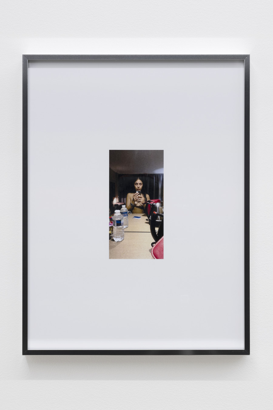 Mati Jhurry, duty free_Emirates Staff No.460596, 2025, Series of 9 photographs pulled from the archive of performance Emirates Staff no. 460596, digital print on paper, aluminium frame, 31 × 41 × 2 cm each. Photography: Gina Folly / all images copyright and courtesy of the artists and For, Basel