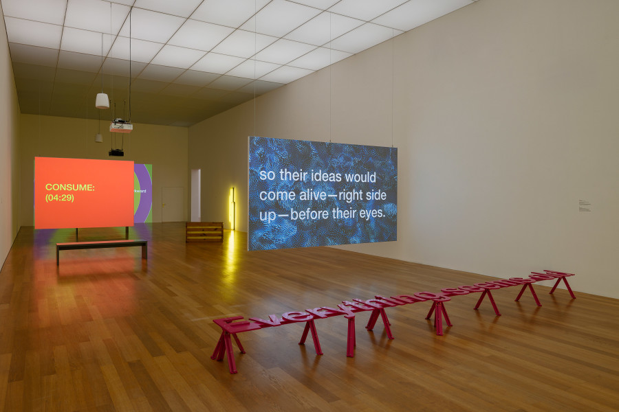 Installation view, Tony Cokes, Let Yourself Be Free, Kunstmuseum Liechtenstein, 2025-2026. Works by Tony Cokes, Gary Kuehn, Dan Flavin. Photo credit: kunst-dokumentation.com. © Tony Cokes / Gary Kuehn / 2025, ProLitteris, Zurich / Kunstmuseum Liechtenstein