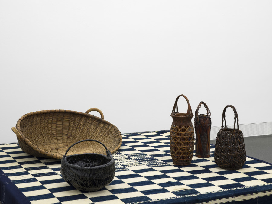 Anonymous, Bamana or Fulani blanket from Mali (Detail), hand-spun cotton in indigo blue with variations, 1950s; Anonymous, Chaff Sieve, Woven willow basket, Bern, Switzerland; Mai-Thu Perret, Abnormally avid II, Glazed ceramics, steel, 2019; Anonymous, Hanakago (Flower Baskets), Showa era (1926–1989). Photo: Cedric Mussano