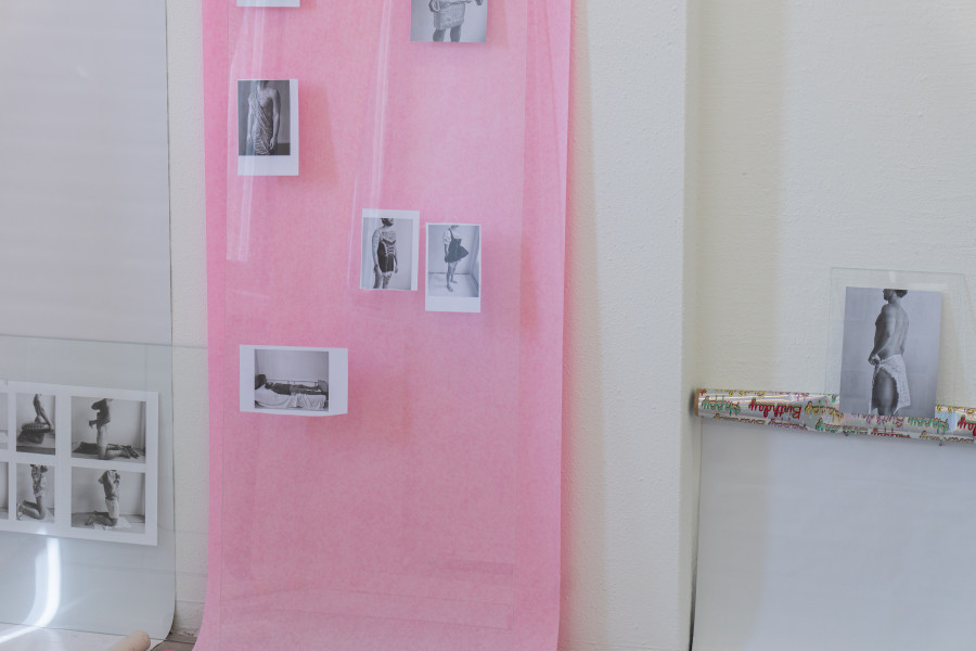 Exhibition view, Sven Gex, celebratory, Halmet, Zürich, 2025. Sven Gex, celebratory, 2025, gift wrapping paper, nails, glass, printed images from the ‚character fitting‘ series 2021-ongoing