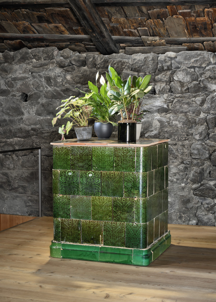 AUGUSTAS SERAPINAS Plants Stove, 2022 | tiles, wood and plants, 108 × 100 × 100 cm and plants Courtesy of Galerie Tschudi and the artist Photo by Ralph Feiner