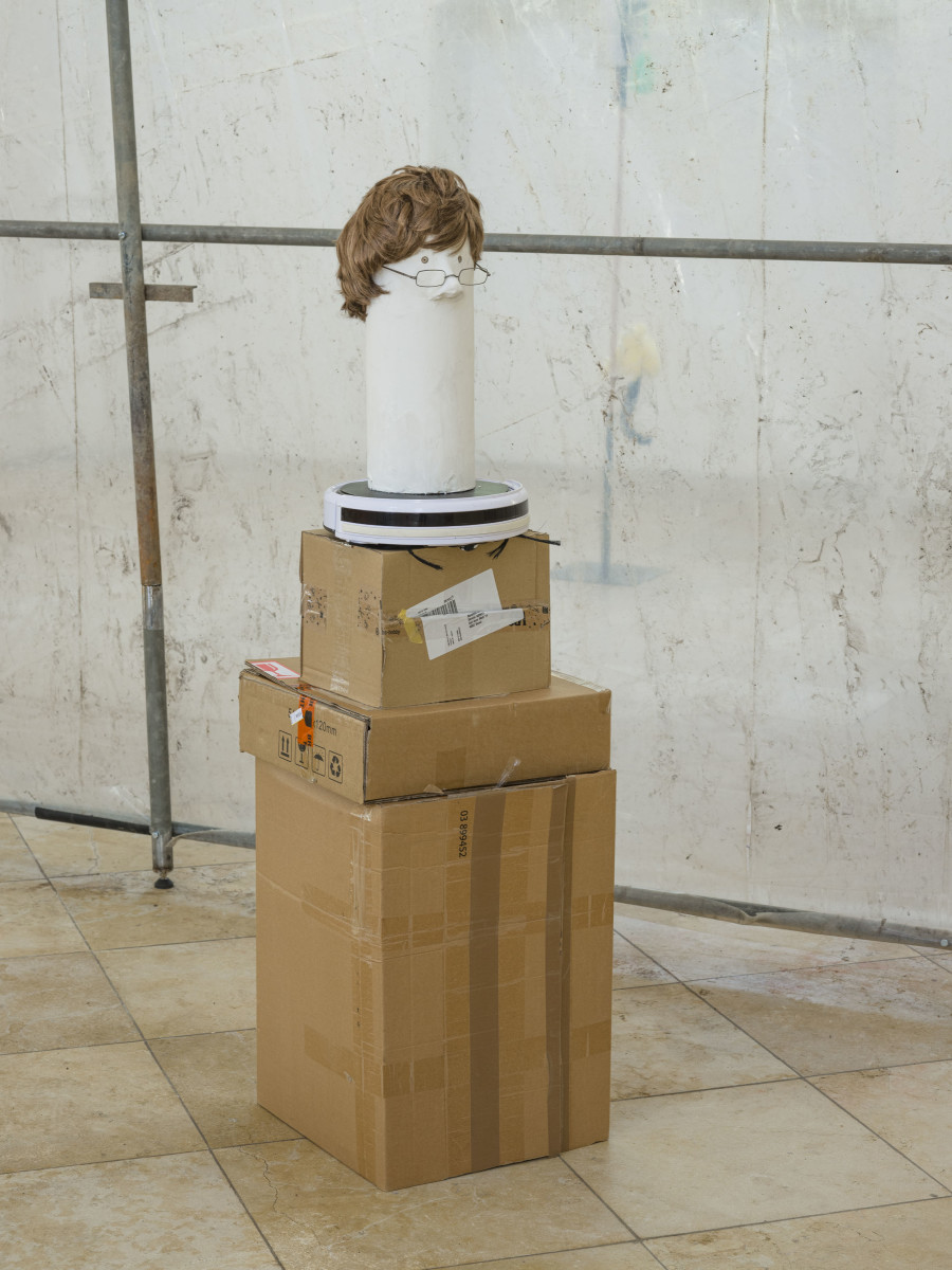 Benedikt Bock, What People Want is Not What People Need (Günther), 2023. Cardboard, plaster, clay, wood, wig, glasses, 160 x 43 x 43 cm. Photo credit: Sebastian Verdon / Abbatiale Bellelay