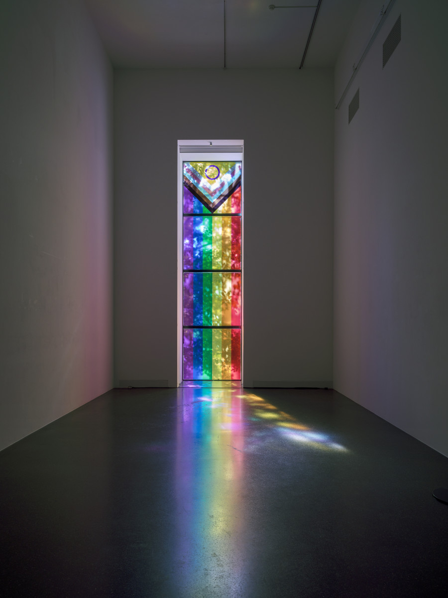 Puppies Puppies (Jade Guanaro Kuriki-Olivo), Spectrum of Color (Window), 2023, Printed self-adhesive film in Progress Pride colors (light blue, pink, white, brown, black, red, orange, yellow, green, indigo, purple, Dimensions variable